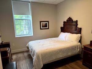 a bedroom with a large bed and a window at Burk's Fall River View 2b2b in Burks Falls
