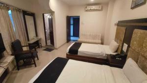 En eller flere senge i et værelse på Collection O Chatrapati Shivaji Bus Terminal Aurangabad