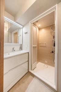 a bathroom with a shower and a sink at 365Ueno in Tokyo +31 photos