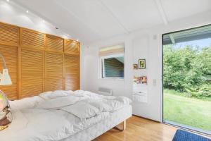 Ένα ή περισσότερα κρεβάτια σε δωμάτιο στο 1555-Dronningmolle-Slaenvangen-34