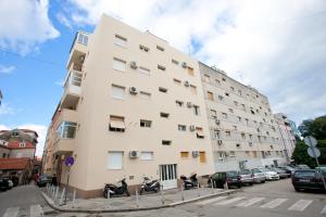 a tall building with motorcycles parked in front of it at Apartment 4 You in Split in Split