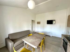 a living room with a couch and a table at AgriResort Il Casolare Rimini in Rimini