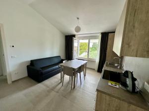 a living room with a couch and a table at AgriResort Il Casolare Rimini in Rimini