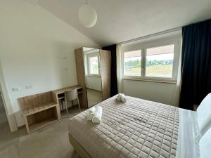 Giường trong phòng chung tại AgriResort Il Casolare Rimini