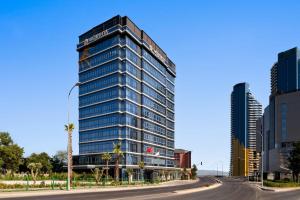 a tall building on a street in a city at La Quinta By Wyndham Istanbul Kartal in Istanbul