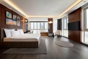 a bedroom with a bed and a desk and a television at La Quinta By Wyndham Istanbul Kartal in Istanbul