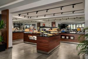 a bakery with a bunch of food on display at La Quinta By Wyndham Istanbul Kartal in Istanbul