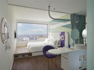 Ένα ή περισσότερα κρεβάτια σε δωμάτιο στο Tru by Hilton Thai Binh City Centre +27 φωτογραφίες