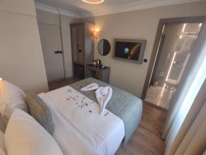 a bedroom with a bed with towels on it at Mara Oldcity Hotel in Istanbul