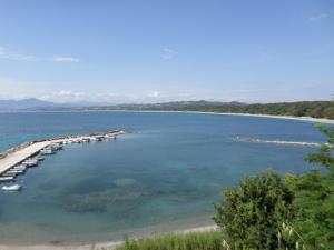 a view of a large body of water with a dock at Galini in Mytikas