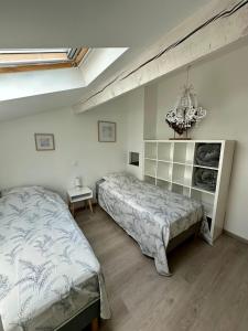 a bedroom with a bed and a chandelier at Mas de l Aire in Corneilla-del-Vercol +146 photos