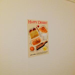 a happy dessert sign hanging on a wall at Cozy Butter Stay Jeonju in Jeonju