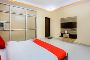 Ένα ή περισσότερα κρεβάτια σε δωμάτιο στο Hotel O The Welcome Mat Hotel