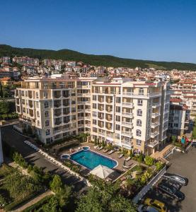 an aerial view of a large apartment building with a pool at Villa Sardinia and Spa in Sveti Vlas