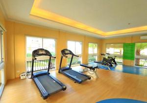 a gym with several treadmills and exercise bikes at San Remo Oasis Cebu City U2331 in Cebu City
