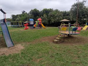 a group of playground equipment in a park at OLOIRIEN HOTEL & RESORT in Narok