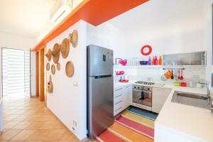 Η κουζίνα ή μικρή κουζίνα στο La Bougainvillea casa vacanze