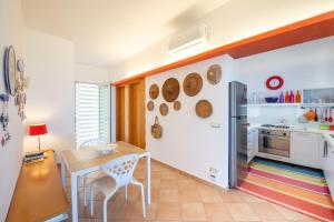 Η κουζίνα ή μικρή κουζίνα στο La Bougainvillea casa vacanze