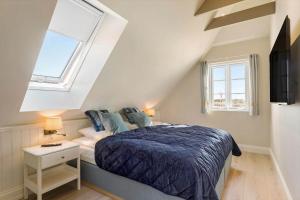 Postel nebo postele na pokoji v ubytování LK1967-Lokken-Sondergade-97 + 21 fotografií