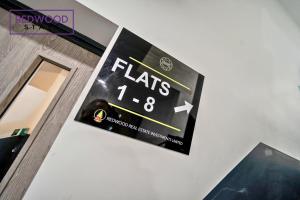 a clock hanging on the wall of a building at Brand New Premium Serviced Apartments, Free Parking, High-Speed WiFi By Redwood Stays in Cove +99 photos