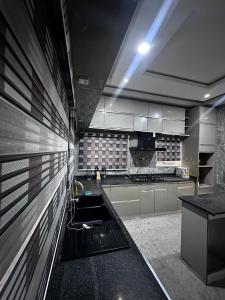 a kitchen with a sink in the middle of it at 4 bedroom duplex in Port Harcourt