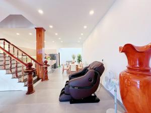 a room with a vase sitting on the floor at Villa Thái An in Phan Thiet +30 photos