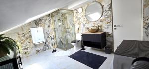 a bathroom with a sink and a mirror at Apartment 5237-3 in Batalaži +8 photos