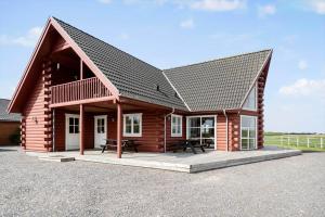 a log cabin with a gambrel roof at 289-Harboore-Strandvejen-179 in Harboør