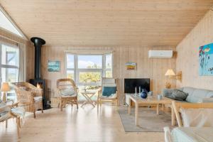 a living room with a couch and a table at 518-Lemvig-Lyngsletten-50 in Lemvig