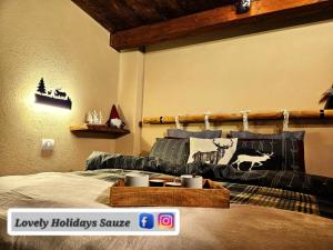 a bedroom with a bed with a wooden head board at BAITA LOVELY AND CENTRAL SAUZE D'OULX in Sauze dʼOulx
