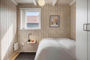 a bedroom with a bed and a window at 528-Lemvig-Stranden-22 in Lemvig