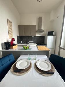 Η κουζίνα ή μικρή κουζίνα στο Appartement Roanne proche hopital