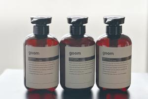 a group of three bottles of soap on a table at goom Hotel Fukuoka-Kokusai-Center in Fukuoka
