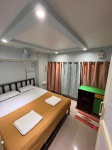 Ένα ή περισσότερα κρεβάτια σε δωμάτιο στο MAMA Lodging & Boarding