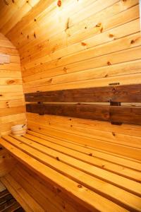 an empty sauna with wooden walls and ceilings at Эко Парк in Bălţi