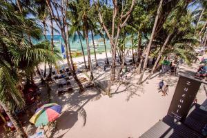 an overhead view of a beach with a colorful umbrella at Zuzuni Boutique Hotel in Boracay