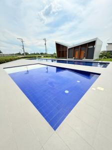 a swimming pool with blue tiles on a building at 2Js VILLA in Bantug