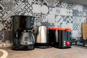 two coffee makers sitting on a counter in a kitchen at Plaza Residence Studio 197 in Bucharest