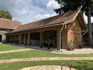 a building with a pavilion in a yard at Lajtorjás in Őriszentpéter