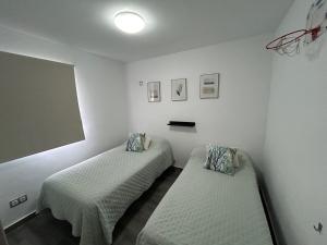 Ένα ή περισσότερα κρεβάτια σε δωμάτιο στο LAS OLAS Apartment