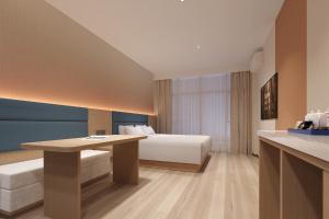 Postel nebo postele na pokoji v ubytování Model J Hotel Jakarta Central Park + 13 fotografií