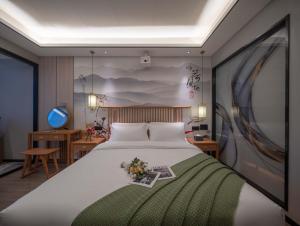 Ένα ή περισσότερα κρεβάτια σε δωμάτιο στο Bohan Shenhua Riverside Resort Hotel +37 φωτογραφίες