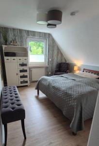 Postel nebo postele na pokoji v ubytování Ferienhaus bei Döpkes to Huus