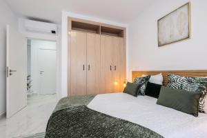 Ένα ή περισσότερα κρεβάτια σε δωμάτιο στο Parque dos Reis Apartment 4 A