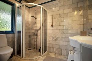a bathroom with a shower and a toilet and a sink at 11136-Nykobing-Sj-Vindingsvej-2 in Nykøbing Sjælland +21 photos