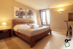 a bedroom with a bed and a window at Hotiday Vezzano Ligure in La Spezia