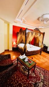 a bedroom with a bed and a couch and a table at Hotel Master Paradise, Pushkar, Rajasthan , INDIA in Pushkar +89 photos