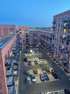 an aerial view of a parking lot with parked cars at Cozy 1 bedroom flat in city centre in Birmingham