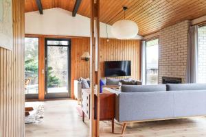 a living room with a couch and a tv at 13371-1-Vig-Tjornedalen-3 in Vig