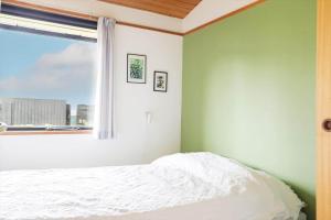 a bedroom with a white bed and a window at 13371-1-Vig-Tjornedalen-3 in Vig